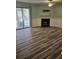 Spacious living room featuring wood flooring, fireplace, tv hookups and sliding doors at 2326 Treescape Dr # 2, Charleston, SC 29414