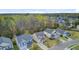 Aerial view of a neighborhood showcasing well-maintained homes, lush greenery, and mature trees at 236 Emerald Isle Dr, Moncks Corner, SC 29461
