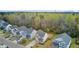Aerial view of well-maintained homes with driveways and fenced yards backing up to mature trees at 236 Emerald Isle Dr, Moncks Corner, SC 29461