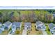 Aerial view featuring a residential neighborhood with lush green trees in the background at 236 Emerald Isle Dr, Moncks Corner, SC 29461