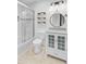 This bright bathroom features a vanity, a glass-doored shower, and stylish wooden shelves at 236 Emerald Isle Dr, Moncks Corner, SC 29461