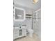 This bathroom offers a glass enclosed shower, modern vanity with stylish sink, and beautiful wood plank walls at 236 Emerald Isle Dr, Moncks Corner, SC 29461
