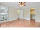 Bedroom featuring hardwood floors and multiple doorways to closet and bathroom at 236 Emerald Isle Dr, Moncks Corner, SC 29461