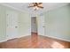 Bedroom featuring hardwood floors and multiple doors, creating a versatile space at 236 Emerald Isle Dr, Moncks Corner, SC 29461