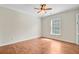 Bedroom featuring hardwood floors, a ceiling fan, and a window providing natural light at 236 Emerald Isle Dr, Moncks Corner, SC 29461