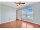 Bright bedroom with hardwood floors, a ceiling fan, and a window providing natural light at 236 Emerald Isle Dr, Moncks Corner, SC 29461