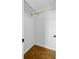 Walk-in closet with wood-look floors and a rod, offering storage space at 236 Emerald Isle Dr, Moncks Corner, SC 29461