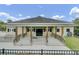 A traditional clubhouse featuring wooden accents, pillars, and a welcoming entrance at 236 Emerald Isle Dr, Moncks Corner, SC 29461