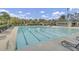An inviting swimming pool with marked lanes is surrounded by lounge chairs and lush landscaping at 236 Emerald Isle Dr, Moncks Corner, SC 29461