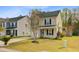 Quaint two-story home with tidy landscaping and a cozy front porch at 236 Emerald Isle Dr, Moncks Corner, SC 29461