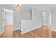 Bright hallway with hardwood floors connects various rooms within the home at 236 Emerald Isle Dr, Moncks Corner, SC 29461