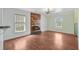 Bright living room featuring a fireplace, big windows, and light-colored walls at 236 Emerald Isle Dr, Moncks Corner, SC 29461