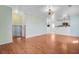 Open living area with views into kitchen, showcasing light walls and wood floors at 236 Emerald Isle Dr, Moncks Corner, SC 29461