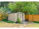 Backyard view of a shed with landscaping and wooden fence at 236 Emerald Isle Dr, Moncks Corner, SC 29461