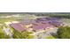Stunning aerial view of Cane Bay Elementary with well-maintained grounds, colorful roofing and an inviting courtyard at 261 Celestial Blvd, Summerville, SC 29486