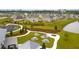 Aerial view of a community area with picnic tables and firepit, surrounded by lush green spaces at 261 Celestial Blvd, Summerville, SC 29486