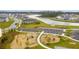 Overhead image of a community park with a playground and seating, set amongst the homes and greenery at 261 Celestial Blvd, Summerville, SC 29486