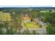 Aerial view showcases the property and surrounding landscape including the home and detached outbuilding at 276 S Railroad Ave, Harleyville, SC 29448