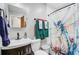 Modern bathroom with a dragonfly shower curtain, and wood vanity at 276 S Railroad Ave, Harleyville, SC 29448