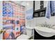 Cozy bathroom with a truck-themed shower curtain and dark vanity with a white sink at 276 S Railroad Ave, Harleyville, SC 29448