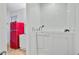 Stylish bathroom featuring a walk-in tub and bright red retro refrigerator at 276 S Railroad Ave, Harleyville, SC 29448