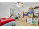 Bedroom view with wood-look laminate floors, and packed boxes for easy moving at 276 S Railroad Ave, Harleyville, SC 29448