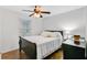Bright bedroom with neutral colors, a ceiling fan, and hard wood floors at 276 S Railroad Ave, Harleyville, SC 29448