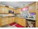 Bright kitchen featuring granite countertops, stainless steel appliances, and ample cabinet space at 276 S Railroad Ave, Harleyville, SC 29448