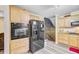Well-equipped kitchen featuring stainless steel appliances, wooden cabinets, and plenty of storage space at 276 S Railroad Ave, Harleyville, SC 29448