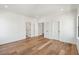 Spacious bedroom featuring pristine white walls and elegant hardwood flooring at 2950 Lodge Berry Ln, Johns Island, SC 29455