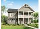 Charming two-story home featuring a covered front porch and a well-manicured lawn at 2950 Lodge Berry Ln, Johns Island, SC 29455