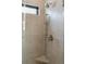 Modern shower featuring sleek tile and a stylish shower head with handheld wand at 2950 Lodge Berry Ln, Johns Island, SC 29455