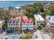 Stunning aerial view showcasing beautiful homes with red roofs and blue shutters near the water at 3 Atlantic St, Charleston, SC 29401