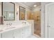 Bright bathroom with double vanity, stone shower, and sophisticated fixtures at 3 Atlantic St, Charleston, SC 29401