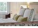 Close up of a well-made bed with throw pillows at 3 Atlantic St, Charleston, SC 29401