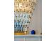 Elegant chandelier with cascading glass tubes and bronze-colored beads, adding a touch of sophistication to the interior at 3 Atlantic St, Charleston, SC 29401