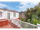 Open-air deck features white railing with views of mature trees and neighboring building at 3 Atlantic St, Charleston, SC 29401