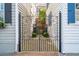 Ornate wrought iron gate leading to a private courtyard and beautifully maintained property at 3 Atlantic St, Charleston, SC 29401