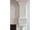 Close up view of an ornate, antique fireplace with white mantle and trim at 3 Atlantic St, Charleston, SC 29401