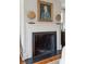 Close up view of a fireplace with white mantel and decor at 3 Atlantic St, Charleston, SC 29401