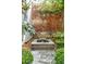Idyllic water fountain and lovely landscaping enhances backyard ambiance at 3 Atlantic St, Charleston, SC 29401