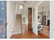 Inviting foyer with hardwood floors, staircase, and views into the living room at 3 Atlantic St, Charleston, SC 29401