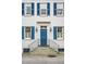Elegant home entrance with a blue door, classic sidelights, and decorative lanterns at 3 Atlantic St, Charleston, SC 29401