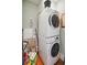 Efficient laundry area with stacked washer and dryer, maximizing space in a compact room at 3 Atlantic St, Charleston, SC 29401