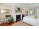 Well-lit main bedroom featuring a decorative fireplace and sitting area at 3 Atlantic St, Charleston, SC 29401