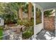 Charming patio features mature landscaping and stylish outdoor seating area for entertaining at 3 Atlantic St, Charleston, SC 29401