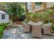 Private backyard patio boasts a stone surface and garden area for relaxing outdoors at 3 Atlantic St, Charleston, SC 29401