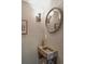 Stylish powder room with a unique stone sink and elegant lighting fixtures at 3 Atlantic St, Charleston, SC 29401