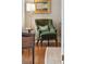 Cozy reading nook with an upholstered armchair and side table at 3 Atlantic St, Charleston, SC 29401