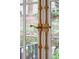 Close-up of window hardware with aged brass finish at 3 Atlantic St, Charleston, SC 29401